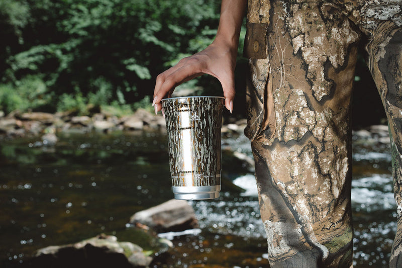 Realtree Top Cup camping kitchen setup at a campsite